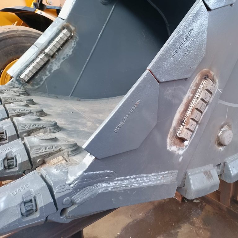 Added choccy block and button wear plates to a 30 ton excavator bucket