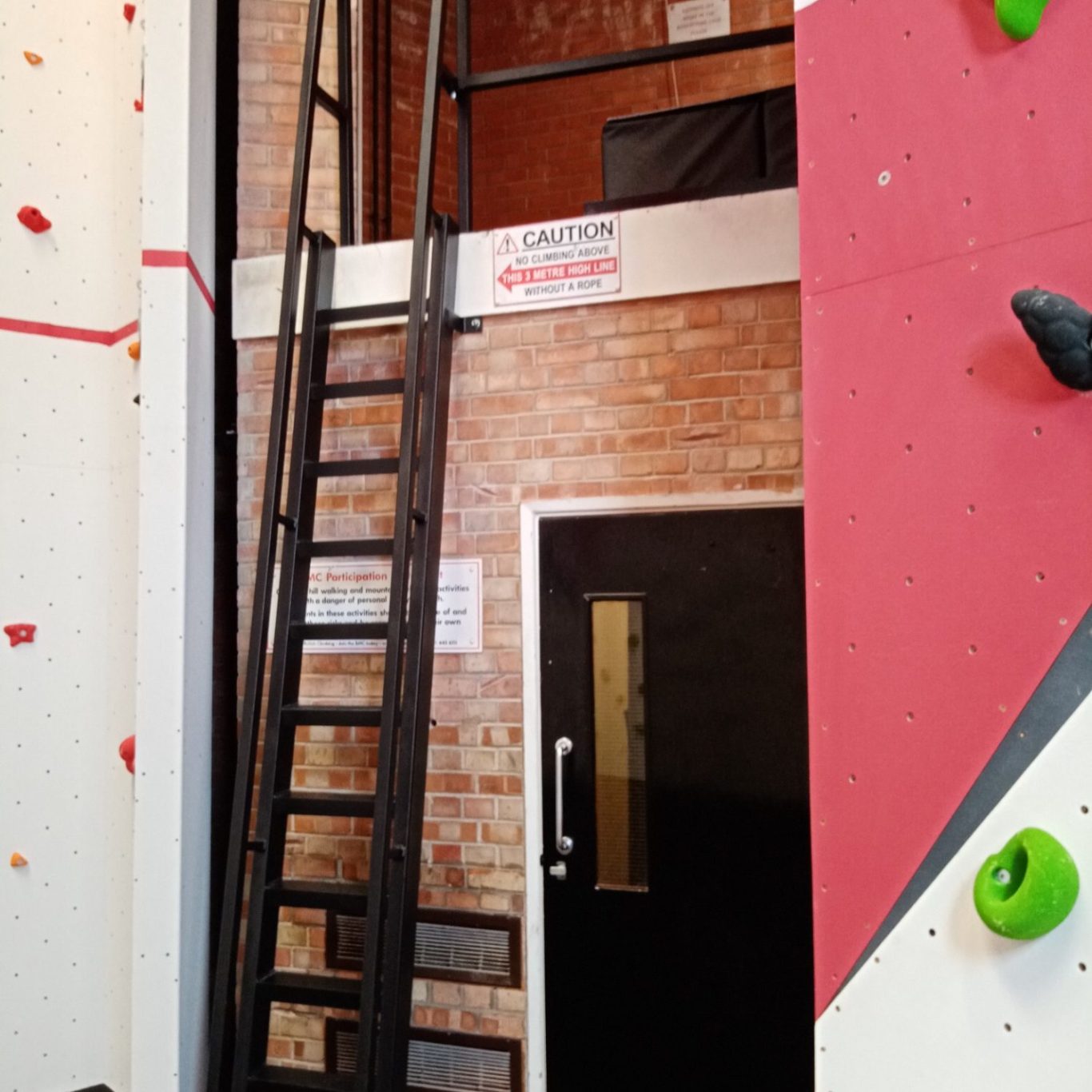 A bespoke ladder to a mezzanine in a climbing wall