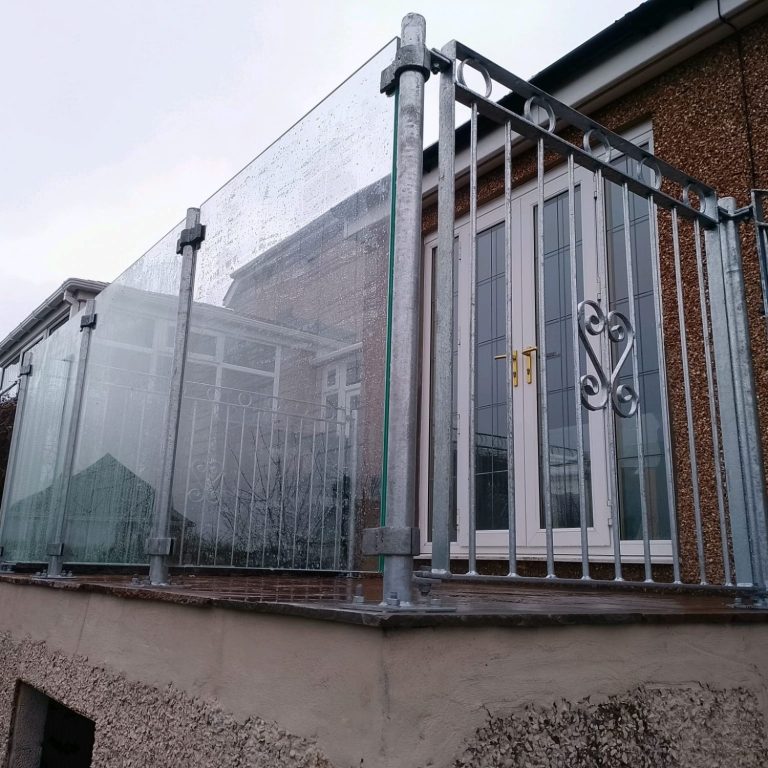 Galvanised railings with glass panels in Workington