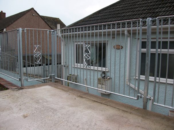 galvanized metal edge protection railings with decorative scroll work