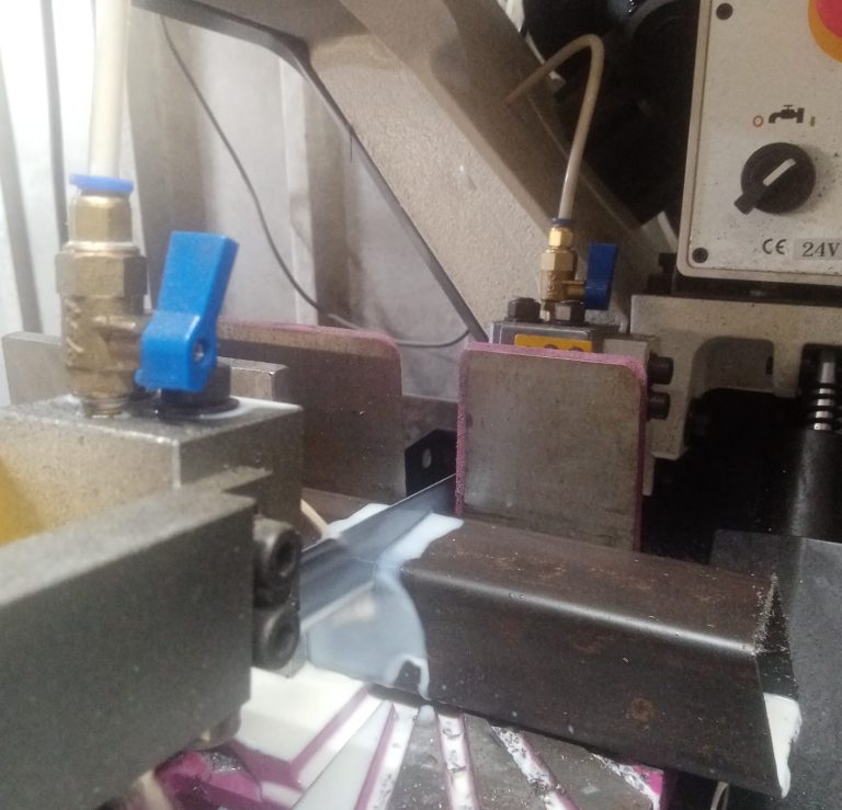 Cutting steel box section on a bandsaw | Glenview Steel